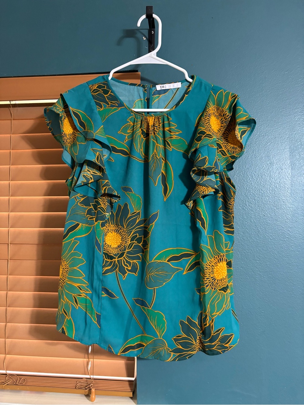 Teal ruffle sleeve blouse with green and yellow flowers
